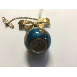 A late 1940s Uno enamel globe ball pendant watch on a 9ct bow brooch,