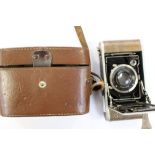 A cased, Krauss Rollette Luxus camera, 1927-1928, snakeskin covering.