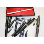 A Calligraphy pen with various nibs (Italian), a ball pen and cigarette lighter,