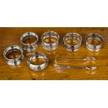 Six various silver napkin rings including a pair Chester 1913 and a pair of sugar tongs,