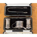 A cased three piece silver condiment set, Birmingham 1933, E.