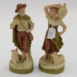 A pair of Royal Dux figures of a boy, a/f,