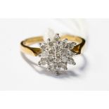 A diamond cluster ring set in 9ct gold, size M,