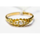 A diamond, five stone boat head ring set in 18ct gold, size Q1/2,