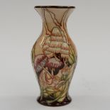 A Moorcroft 1st quality vase in a special colourway in he Lionshield (Market day) pattern,