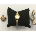 A 9ct rosegold cased lady's wristwatch and two other yellow metal writs