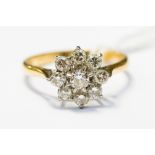 A diamond flower cluster ring, set in 18ct yellow and white gold,