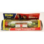 Dinky: A boxed Eagle Transporter, '359', box worn, vehicle good.