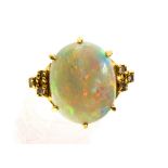 **REOFFER IN JANUARY A&C £500-£700** An 18ct opal and diamond dress ring,