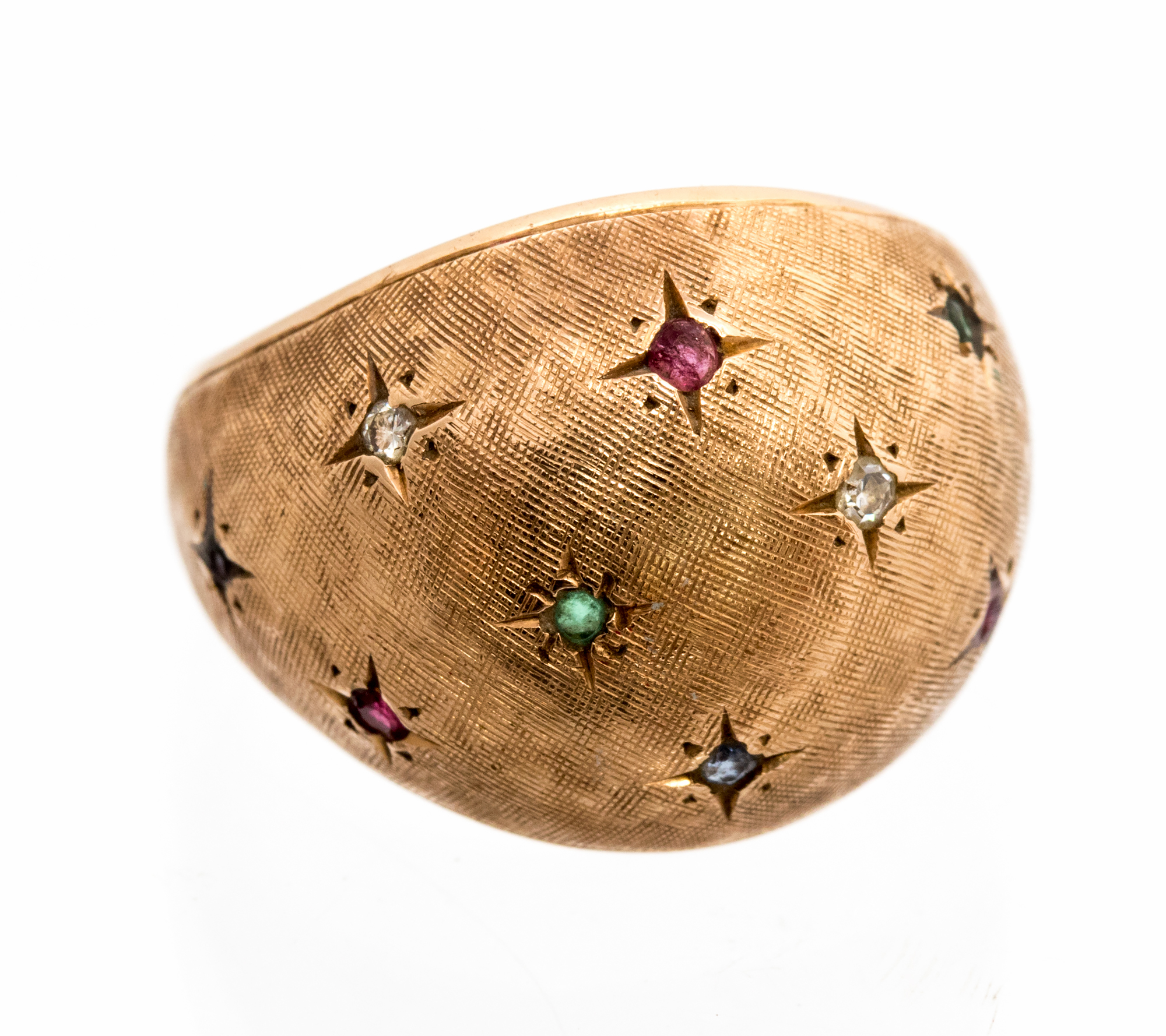 A yellow gold boule head ring, the textured domed head star set with small diamonds, rubies,