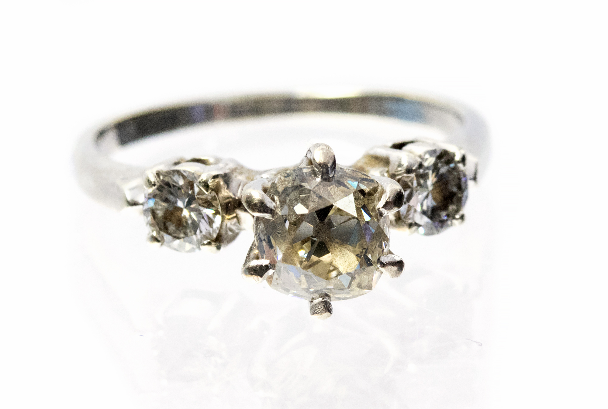 **REOFFER IN JANUARY A&C £600-£800** A diamond three stone ring,