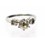 **REOFFER IN JANUARY A&C £600-£800** A diamond three stone ring,