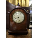 An Edwardian Maple & Co mahogany bracket clock, barbers pole strung, caddy top with ball finials,