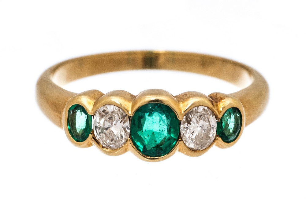 **REOFFER IN JANUARY A&C £800-£1200** An emerald and diamond five stone 18ct yellow gold ring,