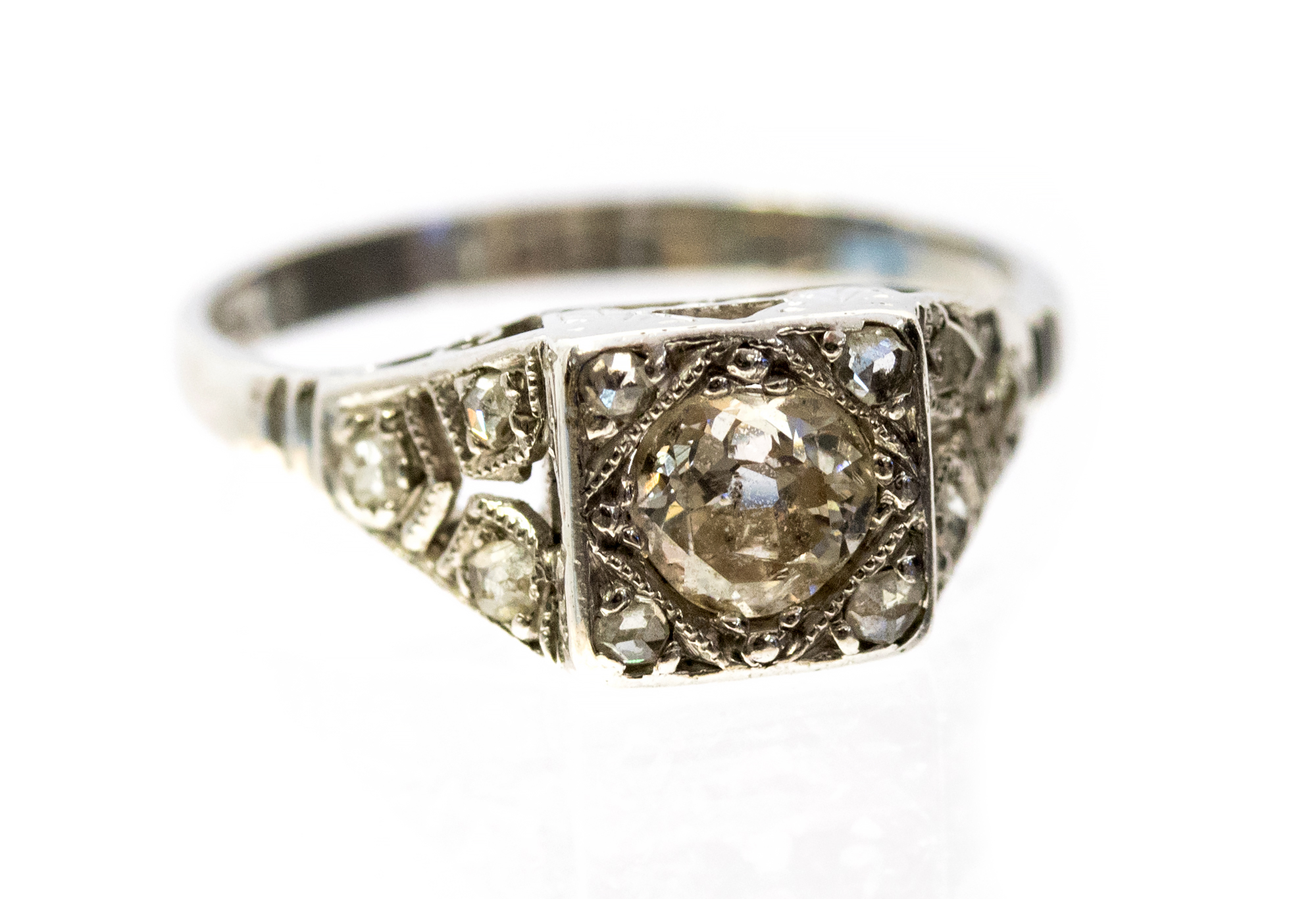 An Art Deco diamond and platinum ring, set centrally with an old cut diamond approx .