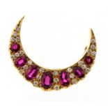 **REOFFER IN JANUARY A&C £600-£800** A red spinel and diamond 18ct gold crescent shaped brooch,