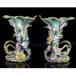 A pair of florally encursted cornucopia vases, Coal print style,