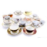 A collection of various Staffordshire cups and saucers,
