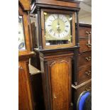 An oak longcase clock case, with a square cornice,