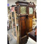 A George III oak longcase clock, broken pediment, columns to hood,