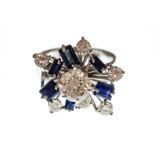 A diamond and sapphire fancy cluster white gold ring,