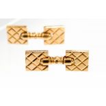A pair of yellow gold cufflinks stamped 14K,