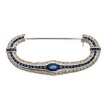 A sapphire and diamond curved bow shape 18ct white gold brooch,