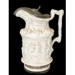 A Staffordshire moulded Stoneware jug with pewter cover,