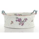 A Derby porcelain basket, relief moulded trellis weave, waisted form,