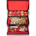 A leather jewellery box containing costume jewellery