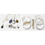 A quantity of silver bangles, necklaces and polished gemstone pendants,