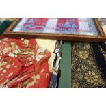 Box of textiles to include, a machine embroidered silk shawl with silk tassels, place mats, doilies,