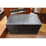 A leather box with embossed geometric design,