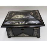 A mid 19th century, Japanned sewing box with mother of pearl inlay, content include,