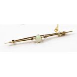 A yellow metal opal and diamond tie pin, 14-15ct probably,