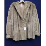 A blond Musquash jacket mid 1940s with turned back cuffs,