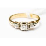 An 18ct gold (tested) three stone diamond ring approx 25 pts, ring size K,