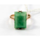 A 9ct jadeite ring, set in rose gold, with a rectangular jadeite, size M,