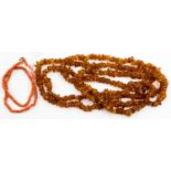 An amber necklace of rough irregular bends, approx 160cms long,