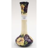 A Moorcroft first quality trial vase in the 'Pansies' pattern on a cream ground,
