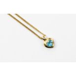 A diamond and blue topaz 18ct yellow gold pendant on 9ct yellow gold chain,