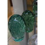 A pair of Victorian green glass dumps,