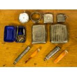 A collection of silver smoking ephemera, including two silver vesta cases,