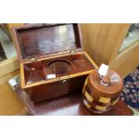 A 19th Century mahogany tea caddy with domed lid, no glass,