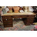 A large Victorian oak twin pedestal desk