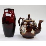 A Royal Doulton flambe vase, together with a 19th century Measham Barge ware teapot and cover,