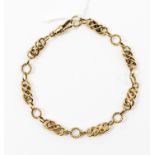 A 9ct gold fancy link bracelet, twisted wreath links between fancy links, toggle fastener,