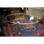 A contemporary glass topped and brass framed coffee table