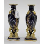 A pair of English porcelain vases with enamel flower detailing,