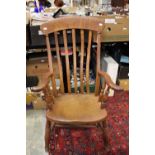 A late 19th Century beech and elm seated high backed kitchen chair